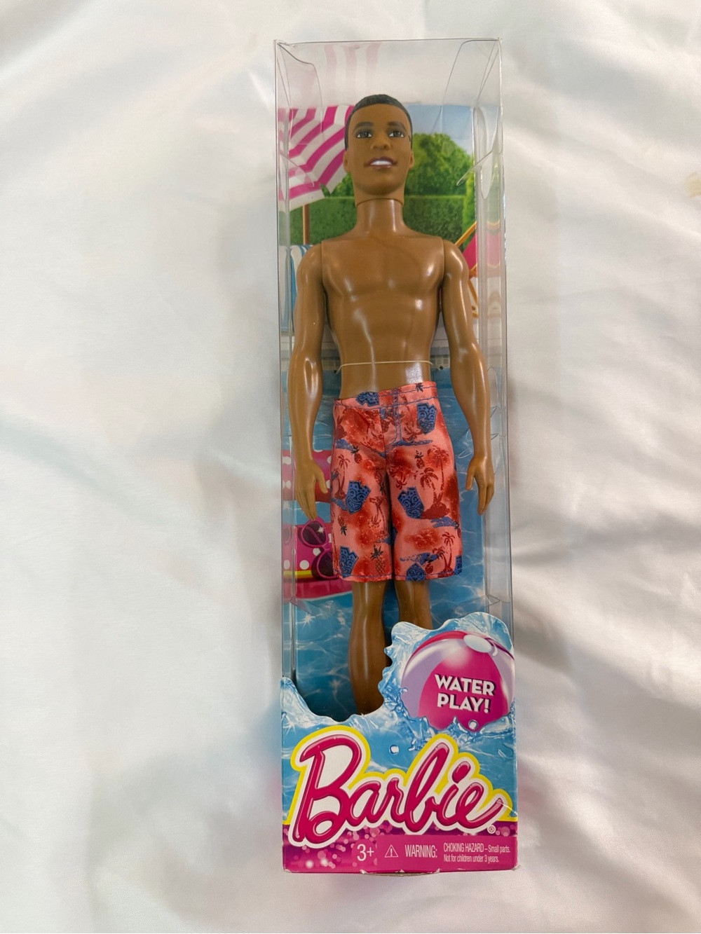 Barbie Brown Male Doll with Coral and Navy Floral Swim Shorts